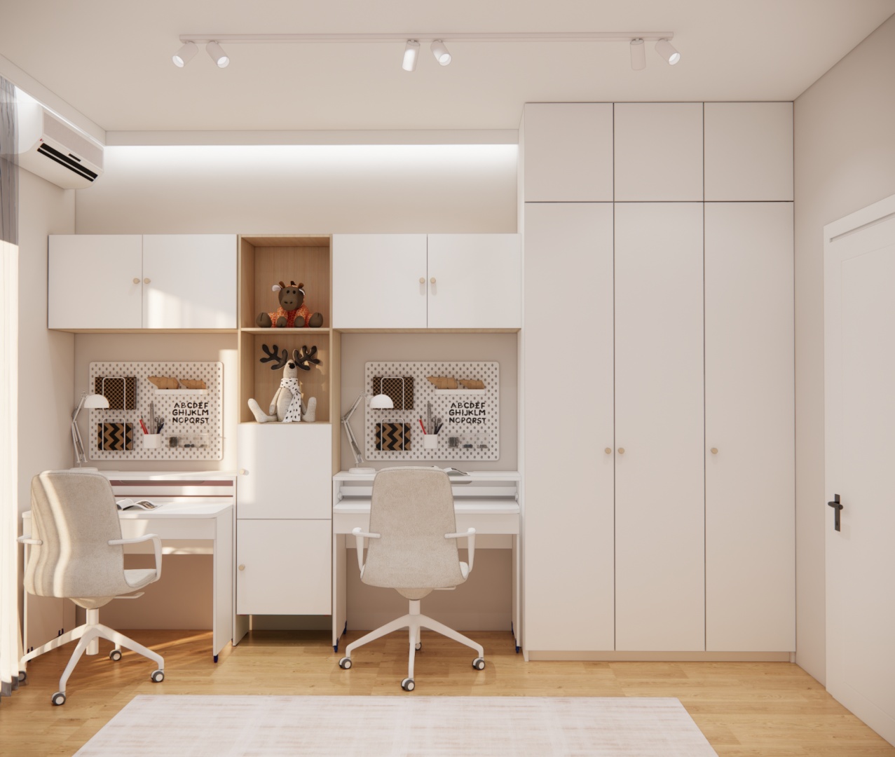 Zabudowa meblowa z podwójnym biurkiem, szafą i miejscem do przechowywania w pokoju dziewczynek.